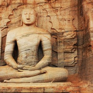 brown concrete statue of a woman